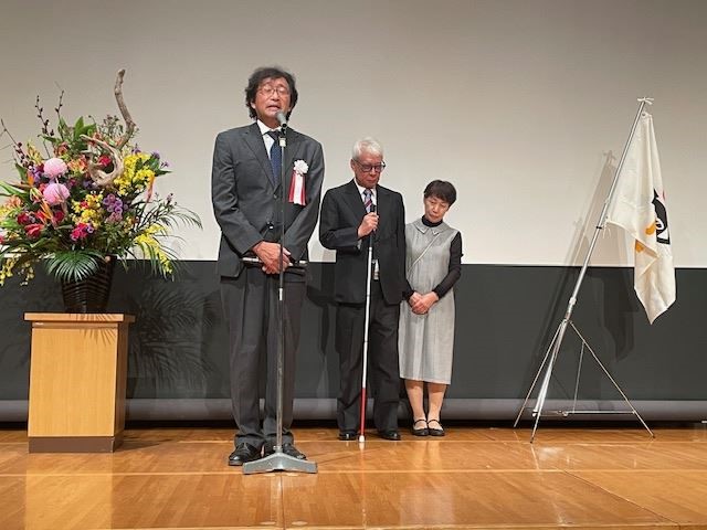 挨拶する今村会長